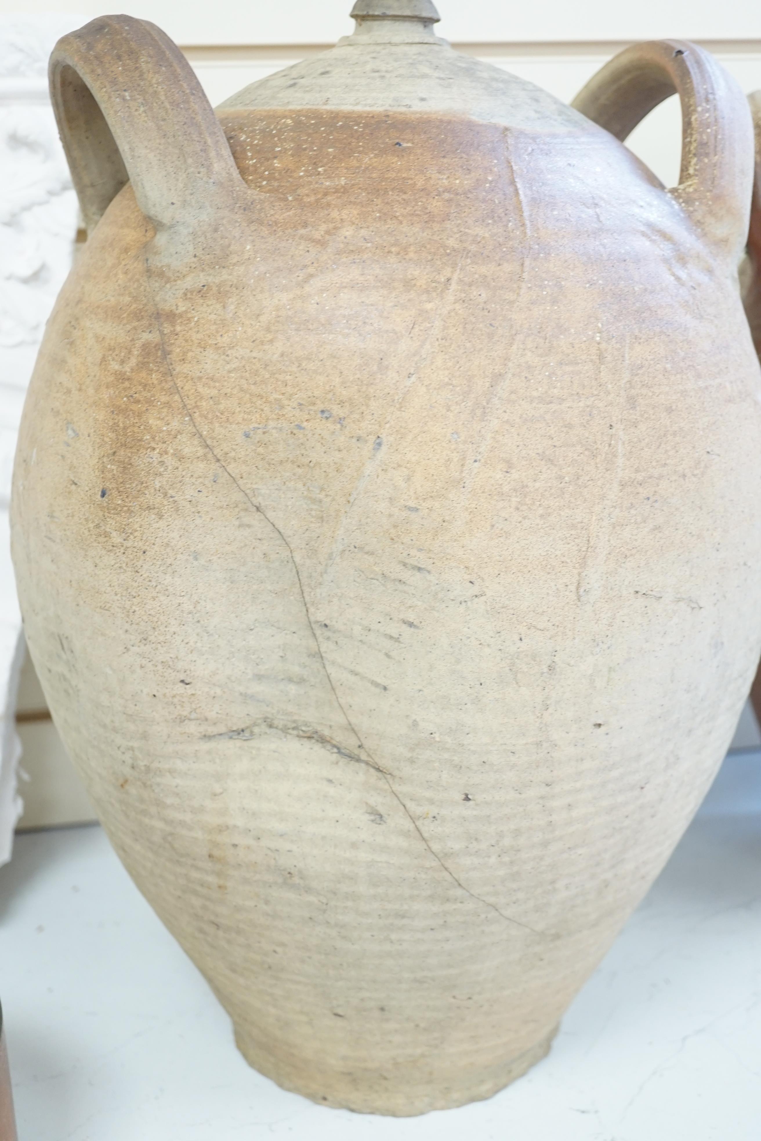 Two terracotta oil jars, tallest 49cm
